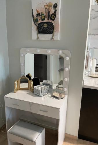 a dressing table with a mirror on a wall at The Balconies Studio, The Marilyn Suite & The Crystal Apartment at Casa of Essence in Old San Juan in San Juan