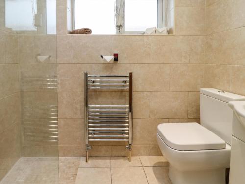 a bathroom with a toilet and a sink at Base Camp in South Shields