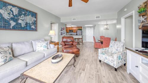 a living room with a couch and a table at St Lucia 1204 a Luxury Condo with Gulf Views in Destin