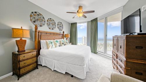 a bedroom with a bed and a large window at St Lucia 1204 a Luxury Condo with Gulf Views in Destin