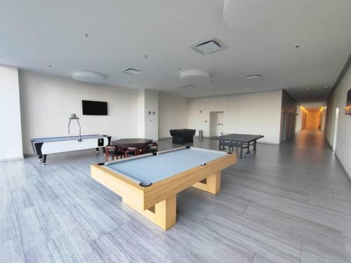 a room with a pool table and ping pong tables at Centro de Convenciones CitiBanamex y Polanco in Mexico City