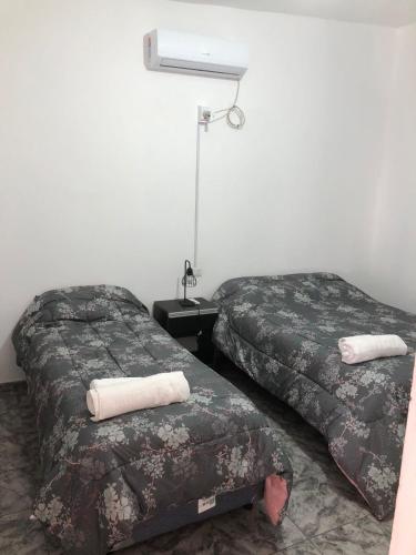 two beds sitting next to each other in a room at la prosperidad in Tinogasta