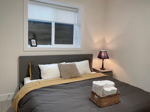 a bedroom with a bed with a window at Blissful Stay in Surrey in Surrey