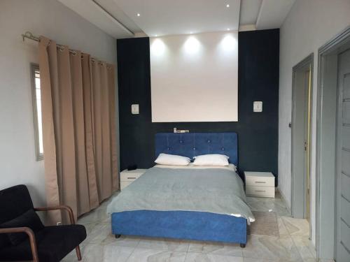 En eller flere senger på et rom på Résidence Schilo - appartement équipé avec piscine privée et rooftop