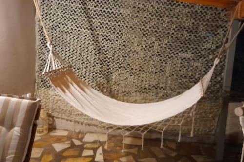 a hammock hanging from a net in a room at Studio Rodies in Neohori Zacharo 