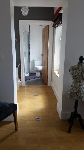 a room with a bathroom with a toilet and a room with at Samona in Kilkeel