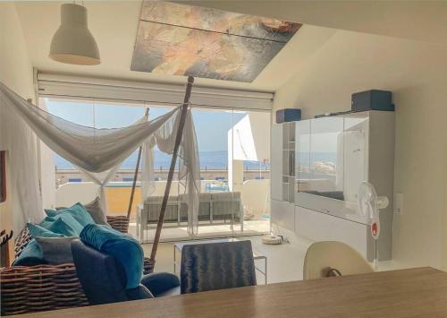 a living room with a view of the ocean at Radazul Seafront Marina 9 in Radazul