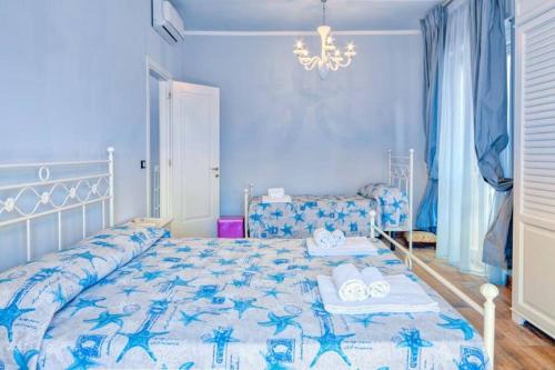 Кровать или кровати в номере Diano Marina Holidays