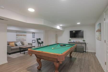 a living room with a pool table in it at Bartram Dream House I - Bartram Beach Retreat in Atlantic City