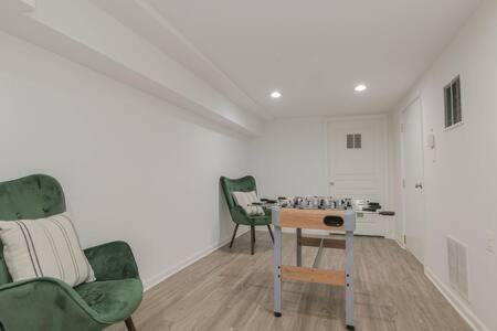a living room with two chairs and a table at Bartram Dream House I - Bartram Beach Retreat in Atlantic City
