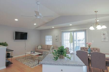 a living room with a couch and a table at Bartram Dream House II - Bartram Beach Retreat in Atlantic City