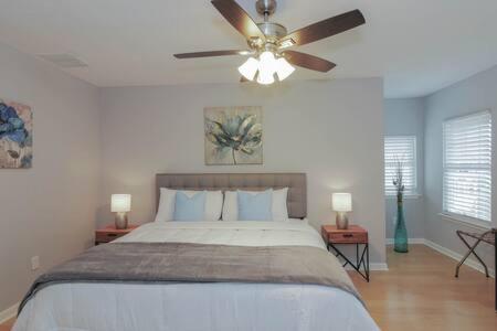 a bedroom with a bed and a ceiling fan at Bartram Dream House II - Bartram Beach Retreat in Atlantic City