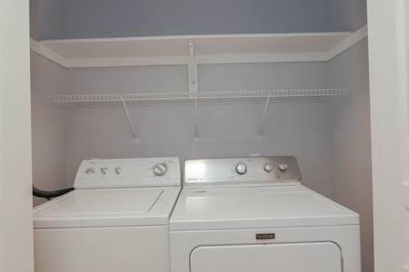 a kitchen with a white stove and a white oven at Bartram Dream House II - Bartram Beach Retreat in Atlantic City