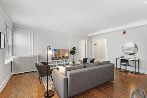 a living room with a couch and a table at Cozy & Radiant 2BR Apartment - BStone 605 in Chicago