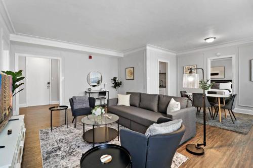 a living room with a couch and a table at Cozy & Radiant 2BR Apartment - BStone 605 in Chicago