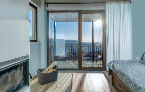 a bedroom with a bed and a balcony with a view at Arachova's Experience M3 in Arachova