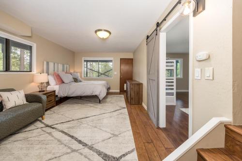 a bedroom with a bed and a couch at Kelly Cabin in Arnold