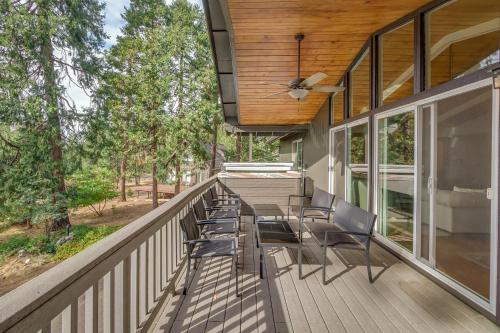 a deck with chairs and a ceiling fan at Kelly Cabin in Arnold
