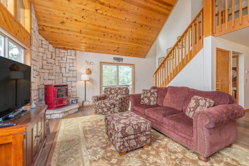 a living room with a couch and a fireplace at Pume Palace in Arnold