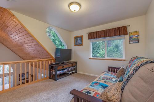 a living room with a couch and a television at The Mellow Moose in Dorrington