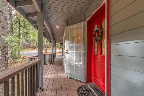 a red door on a house with a porch at The Mellow Moose in Dorrington