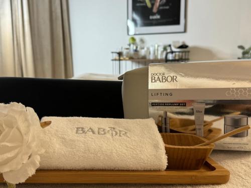 a pile of towels and a box on a table at Health and Spa by Doro im Hotel am Schwanenweiher in Bad Bertrich