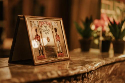 a picture frame sitting on top of a table at Château de Looz in Borgloon