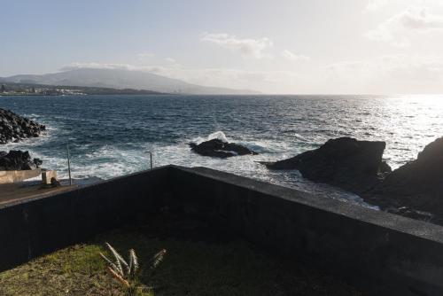 a view of a body of water with the ocean at WelcomeBuddy - SeaLux Apartment in São Roque