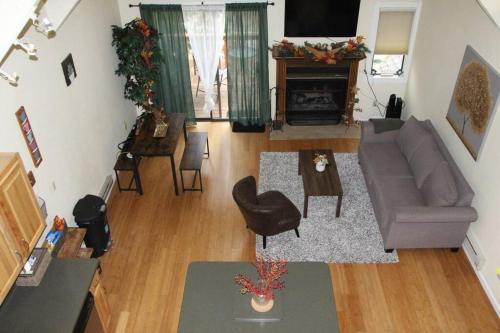 a living room with a couch and a fireplace at Cozy & affordable, Spacious Condo by the lake in Incline Village