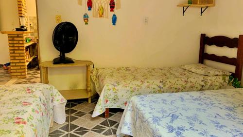 Postel nebo postele na pokoji v ubytování Casa em Mundaú Trairi-Ce