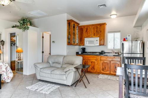 a living room with a chair and a kitchen at 4 Mi to San Tan Mtn Trails Arizona Studio! in Queen Creek