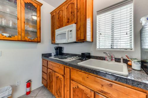 a kitchen with a sink and a microwave at 4 Mi to San Tan Mtn Trails Arizona Studio! in Queen Creek