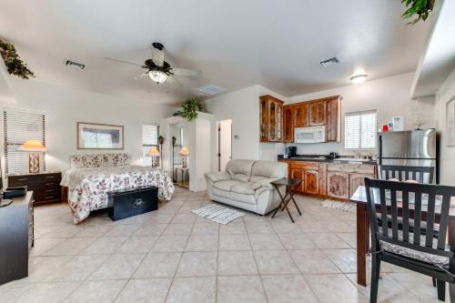 a living room with a couch and a kitchen at 4 Mi to San Tan Mtn Trails Arizona Studio! in Queen Creek