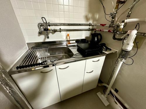 Dapur atau dapur kecil di 1-1地下鉄徒歩圏内サービスアパ―トメントSAPPORO Shiroish iStation エアコンネット完備