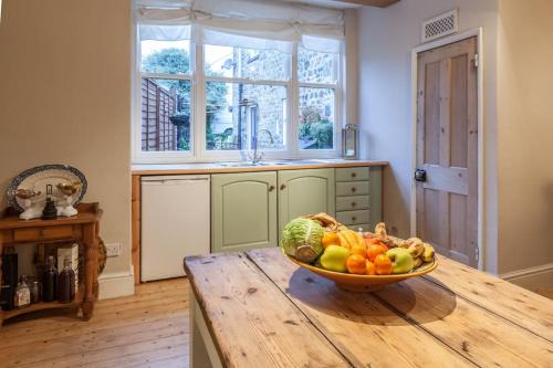 a bowl of fruit on a wooden table in a kitchen at Number 29, a Grade two listed house in Masham in Masham