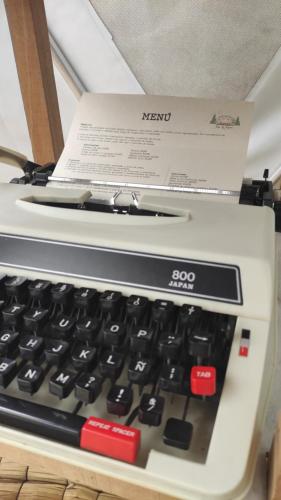 a computer keyboard with a box on top of it at Luz de Luna Glamping in Anolaima