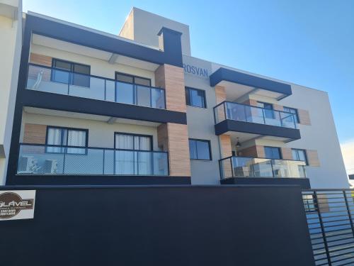 an architectural rendering of a building with balconies at Apartamento Pé na Areia in Itapoa