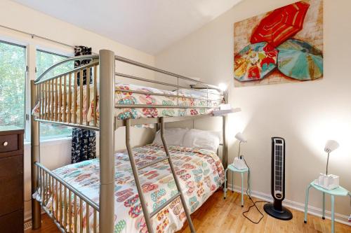 a bedroom with a bunk bed and a bunk bed at Seafarer 7 in Ocean Pines