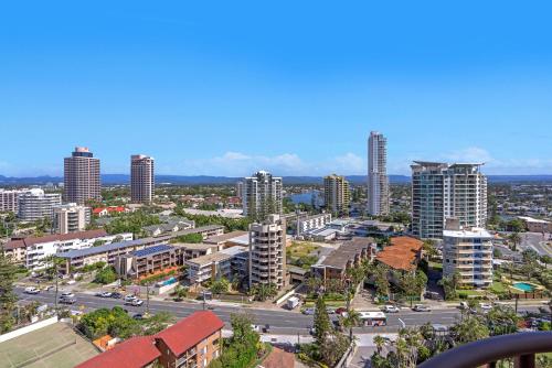 a city with tall buildings and a street with cars at Surfers Aquarius on the Beach in Gold Coast