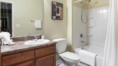 a bathroom with a toilet and a sink and a shower at Landing Modern Apartment with Amazing Amenities (ID1174X415) in Madison