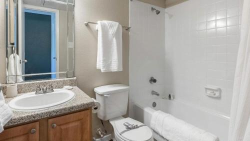 a bathroom with a sink and a toilet and a tub at Landing Modern Apartment with Amazing Amenities (ID9665X12) in Seabrook