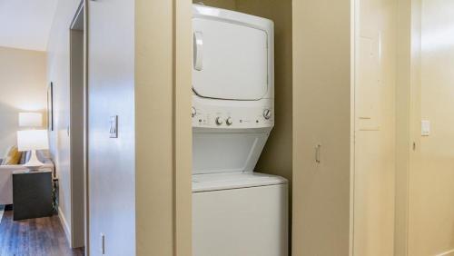 a washer and dryer in a small room at Landing Modern Apartment with Amazing Amenities (ID6647) in Sandy