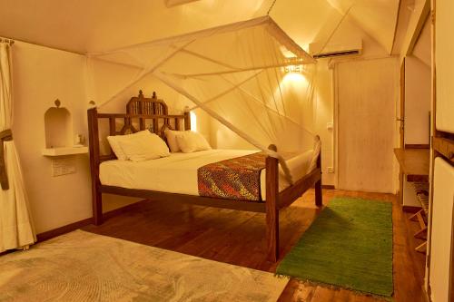 a bedroom with a bed in a tent at Lions' Luxury Eco Resort & Spa in Malindi