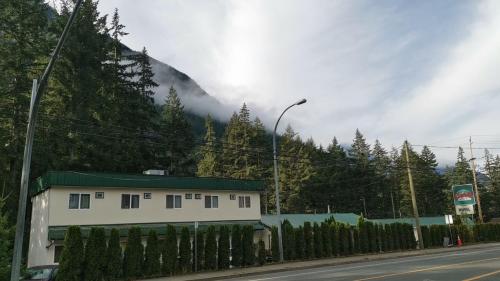 a house on the side of a mountain at Coquihalla Motel in Hope
