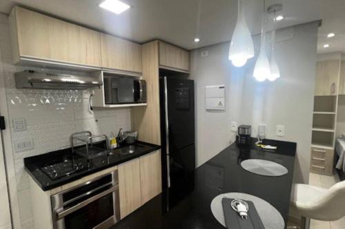 Køkken eller tekøkken på Studio 100% mobiliado e decorado 26