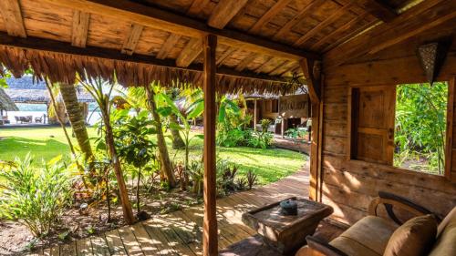 an outside view of a house with a porch at Ratua Private Island Resort in Aimbuei Bay