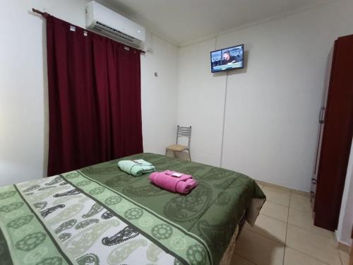 Säng eller sängar i ett rum på Don Oscar Alojamientos Oro Verde I