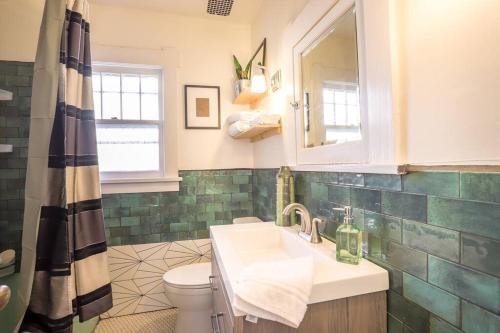 a bathroom with a sink and a toilet at Excellent Location Mins from Dining & DT! in Denver
