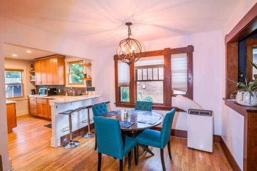 a kitchen and dining room with a table and chairs at Excellent Location Mins from Dining & DT! in Denver