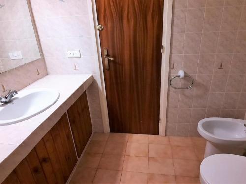 a bathroom with a sink and a toilet at Casa rural Llançà, 2 dormitorios, 4 personas - ES-170-21 in Llança